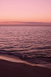 silhouette photography of body of water at golden hour thumbnail