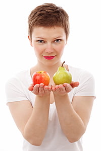 woman holding apple and pear fuits thumbnail