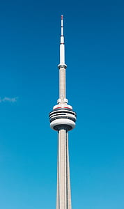 architectural photography of tower under blue sky thumbnail