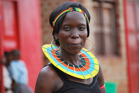 woman wearing black tank top and gold-colored hoop earrings thumbnail