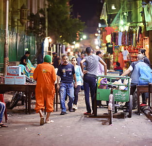men walking in a market area thumbnail