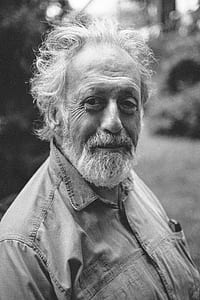grayscale photograph of bearded man thumbnail
