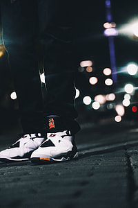 person wearing white-and-black Air Jordan 8 shoes thumbnail