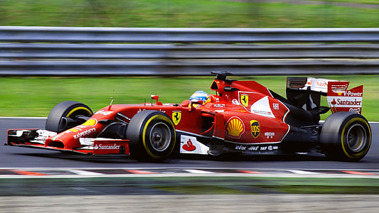 Ferrari F-1 running on race track during daytime thumbnail