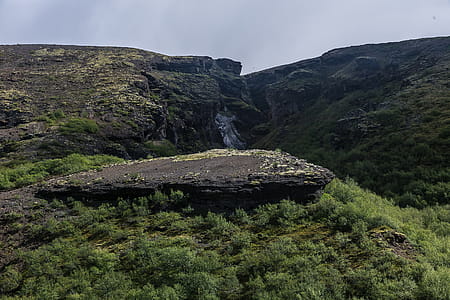 Photo of Mountain Covered Green Grass Under White Sky thumbnail