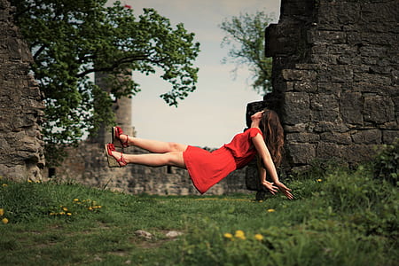 woman levitating above green grasses outdoor thumbnail