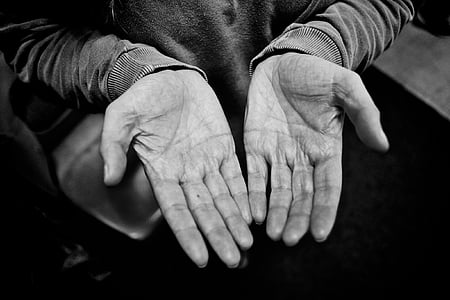 grayscale photo of person wearing long-sleeved top showing both palms thumbnail