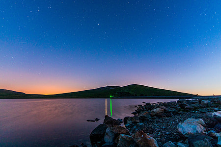 mountain near body of water panoramic photo thumbnail
