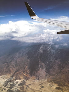 aerial photography of mountain under white thick clouds thumbnail