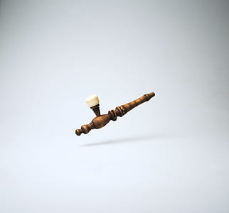 beige and white smoking pipe thumbnail