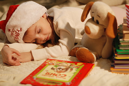 girl's white and red wearing Santa hat while sleeping thumbnail