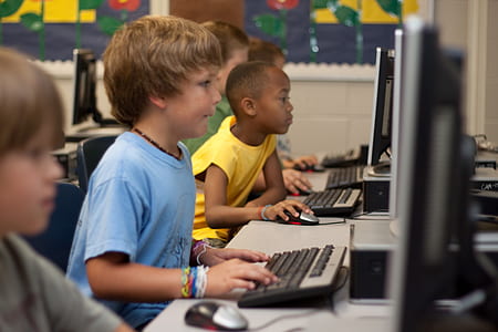 group of boys playing on computers thumbnail