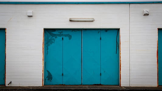 white house with blue garage door thumbnail