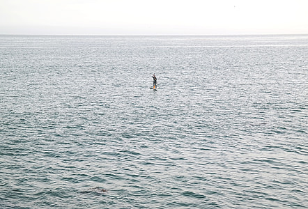 person on body of water during daytime thumbnail