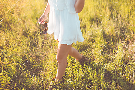 Young Girl Enjoying Her Free Time In a Sunny Meadow thumbnail