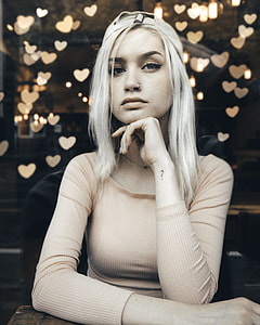grayscale photo of girl with question mark left wrist tattoo thumbnail