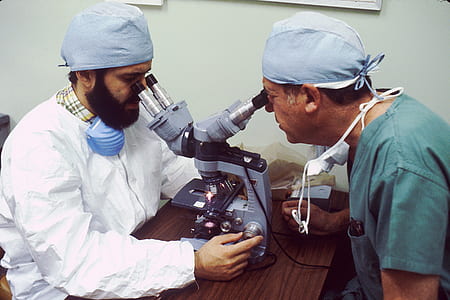 two men looking in microscope thumbnail