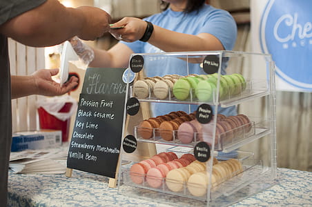 Black Sesame Key Lime Chocolate and Strawberry Macarons in a Glass Display thumbnail