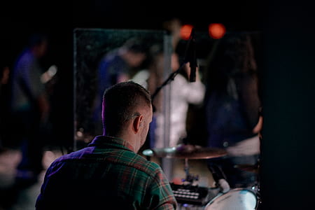 man wearing green and black plaid shirt thumbnail