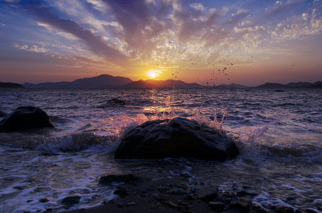 water wave crashing against rock thumbnail
