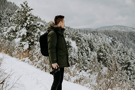 man holding DSLR camera thumbnail