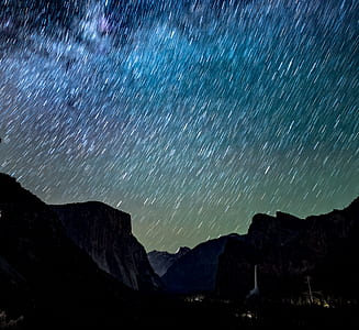 time-lapse photography of mountain at nighttime thumbnail