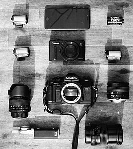 black Canon and Minolta DSLR cameras thumbnail