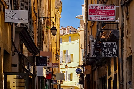 assorted-color signage at daytime thumbnail