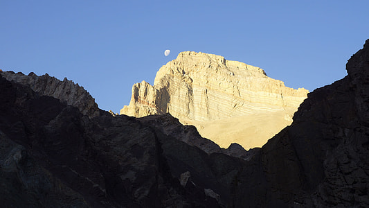 beige rock formation under blue sky thumbnail