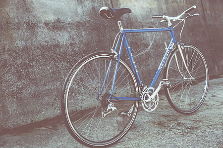 selective focus photography of blue mountain bike thumbnail