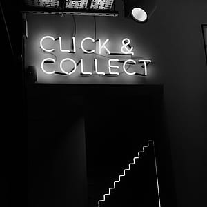 greyscale photo of turned on click & collect lighted signage thumbnail