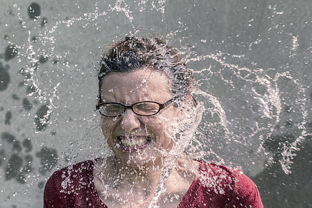 woman smiling with water on his face thumbnail