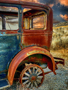 classic blue vehicle near green grass field thumbnail