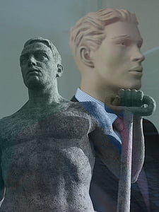 man holding shovel statue thumbnail