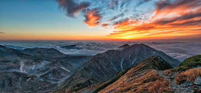 aerial view of green and brown mountain during sunset thumbnail