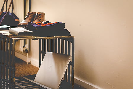 pair of brown leather shoes beside towel thumbnail