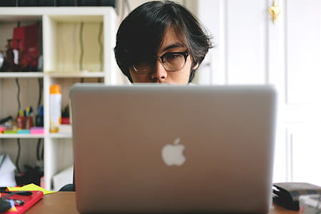 man facing on silver MacBook thumbnail