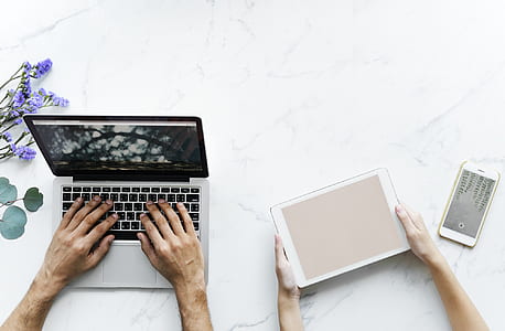 person's hands on laptop computer thumbnail
