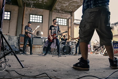 male band performing in building thumbnail