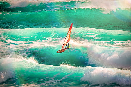 person riding on sailboat at daytime thumbnail