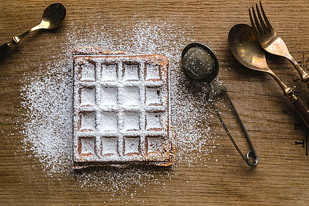 Breakfast waffles with fresh raspberries and powdered sugar thumbnail