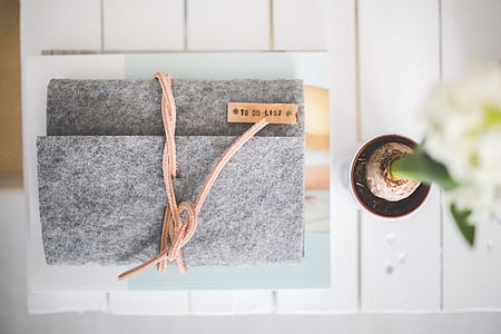 gray handbag on top of white surface thumbnail