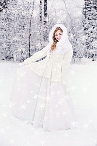 woman wearing long-sleeved dress standing on snow thumbnail