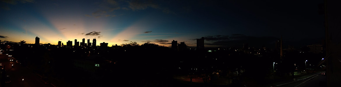 silhoutte photo of city sky thumbnail