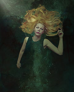 woman wearing black sleeveless dress thumbnail