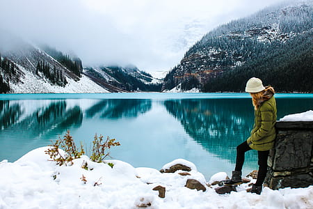 woman standing near bodies of water thumbnail