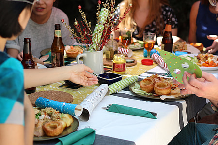 group of people sitting in front of table thumbnail