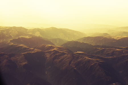 birds eye view of brown rock formation mountins thumbnail