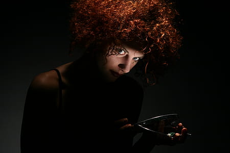 Red Haired Woman in Dark Room thumbnail