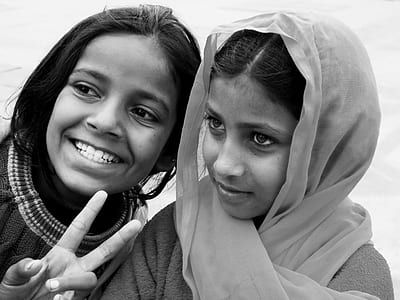 grayscale photo of two girls thumbnail